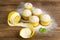 Muffins with lemon and mint on dark wooden table. Top views, close-up