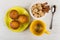 Muffins on saucer, teabag in cup, cinnamon and sugar, spoon