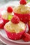 Muffins with white chocolate, fresh raspberries and mint on a ceramic plate, close up.