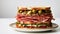 Muffuletta: Sicilian Sesame Bread Sandwich with Olive Salad, Cheese, and Meats