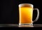 Mug of beer against black background