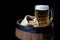 Mug of Beer and Jute Bag with Wheat on Barrel on Black