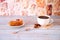 Mug of black coffee on a napkin with anise and a biscuit cake saucer