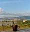 A mug of black tea on the background of the morning panorama of the Zhiguli Hydroelectric Station and the Zhiguli Mountains.