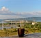 A mug of black tea on the background of the morning panorama of the Zhiguli Hydroelectric Station and the Zhiguli Mountains.