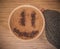 Mug of cappuccino with cinnamon for breakfast.Cinnamon powder in form of a smiley face on coffee foam.
