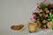 A mug of coffee with milk, oatmeal cookies with cereals and a bouquet of Alstroemeria on a white background in the morning sun.