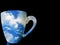 Mug of Coffee with photo screen morning sky.