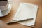 A mug with coffee on the table, a pen lies on a napkin, mockup composition, Generative AI