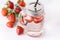Mug of Delicious Refreshing Drink of Strawberry on White Wooden Background Infused Detox Water Above