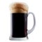 Mug of frosty dark beer with foam