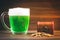 A mug of green beer on the table. Clover leaves. Chest of gold, coins pile. St.Patrick\'s Day.