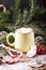 Mug with hot chocolate snow wooden table