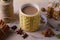 Mug of hot cocoa, good image to convey a feeling of winter and warmth. Winter drink - hot chocolate with cinnamon and anise on woo