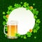 Mug of light beer on green clovers round