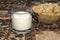 Mug with a sour milk drink and a wooden bowl with rusks