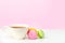 Mug on the table and colored biscuits on a white wooden table