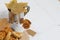 Mug of tea and waffles. Nearby on the table are dried maple leaves, a tea bag and dried oranges. Autumn still life