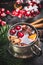 Mug of traditional mulled wine with cranberries, cinnamon sticks and anise star