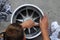 MUGELLO, ITALY - MAY 2012: red bull team mechanic washes the alloy wheels of the formula 1 car during the Official F1 Test Days.