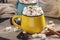 Mugs of hot chocolate with marshmallow on background of chocolate and cinnamon. Concept of a cozy Christmas home holiday