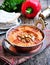 Muhammara dip of sweet peppers with walnuts, cumin, garlic and olive oil.