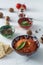 Muhammara dip of sweet peppers with walnuts, cumin, garlic and olive oil.