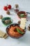 Muhammara dip of sweet peppers with walnuts, cumin, garlic and olive oil.