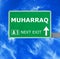 MUHARRAQ road sign against clear blue sky