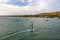 Mui Ne, Vietnam. Man play wind surfing sport in  sea under vast blue sky