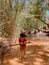 Muine, Vietnam, Fairy Stream. River, red canyon. Little Vietnamese girl playing by the swing.