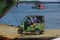 Muisne, Ecuador - March 16, 2016: Green traditional tuktuk transportation vehicle entering ferry from Muisne pier