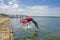 Muisne, Ecuador - March 16, 2016: Kids diving and swimming in pacific ocean from stone surface with clothes on