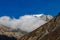 Muktinath - Clouds breaching through the high Himalayan peaks