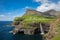 Mulafossur waterfall in Gasadalur village in Faroe Islands, North Atlantic Ocean. Nordic Natural Landscape