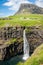 Mulafossur waterfall in Gasadalur village in Faroe Islands, North Atlantic Ocean. Nordic Natural Landscape