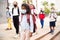 Mulatto tween girl in medical mask on her way to college