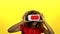 Mulatto in virtual reality glasses is watching an interesting video. Yellow background. Slow motion