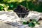 Mulberry in a glass on table. Useful berries in the summer season