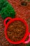 Mulching soil cover made of natural materials.Decorative chips for the garden.Red chips for mulching in red silicone