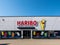 Mulheim-Karlich, Germany - May 18, 2023:: entrance and facade of the Haribo Outlet Store with the famous yellow Haribo bear.