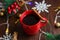 Mulled wine with cinnamon in a red cup. Christmas anticipation concept, view from above