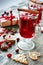 Mulled wine with cranberry, cookies and christmas decorations