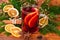 Mulled wine festive decorated on old wooden background