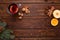 Mulled wine, punch and spices for glintwine on vintage wooden table background top view