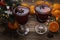Mulled wine or spiced wine in beautiful glasses under the Christmas tree