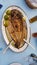 Mullet - open roasted fish lemon dish - food of west Greece called `Petali`