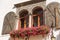 Mullion Window with Metal Shutters and Geranium Flowers - Friuli Italy