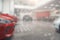 Multi-brand car dealership. Blur the background of the car and Showroom at blurred in workplace. Blurred dealership store, with th