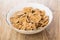 Multi cereal flakes in glass bowl on table